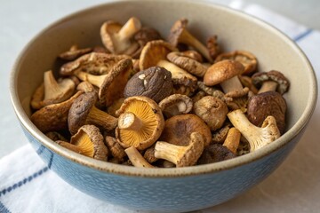 Fototapeta premium A bowl of mushrooms is on a table