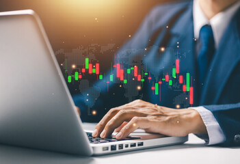Businessman analyzing global financial market charts on laptop, representing stock trading, investment analysis, worldwide market trends, economic data visualization, and digital finance strategy.