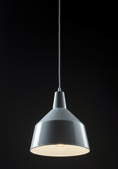 Sleek architectural pendant lamp hanging vertically, currently unpowered, emphasizing its clean lines and geometric shape, empty, depth, modern