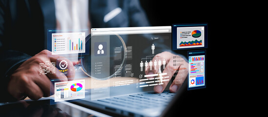 Marketer using digital marketing dashboard with charts, pie graphs, organization chart, and performance data. Concept of business analytics and strategic planning.