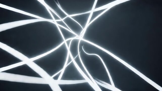 Abstract image of white light trails on a dark background.