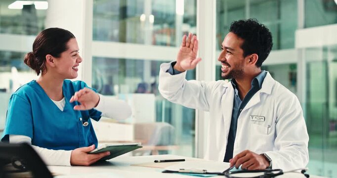 Meeting, high five and doctors with nurses in hospital boardroom for surgery schedule in collaboration. Discussion, professional and team of healthcare employees with medical service in clinic.