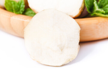 Fototapeta premium Fresh White Cheese with Tzatziki and Mint on Wooden Board