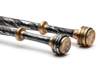 Close up of two medieval style iron rods with golden decorative ends