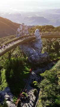 Tourist walking at Golden bridge in Bana hills, Da nang, Vietnam.