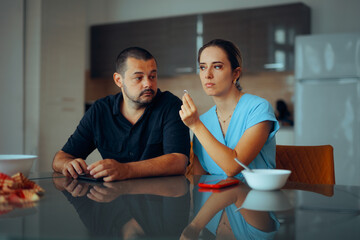 Wife Returning her Wedding Ring to her Husband at the Lunch Table. Woman decides to leave her partner and focus on herself