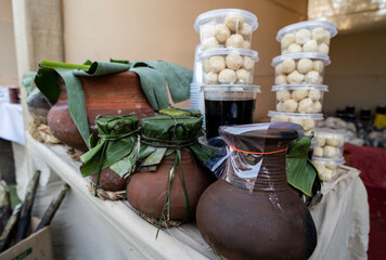 Vendor display curd, laddu, and other food items during Magh Bihu.
