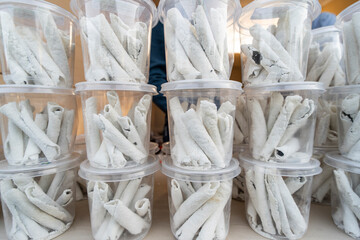 Vendor display Assamese traditional pitha, rice based snacks food items during Magh Bihu.