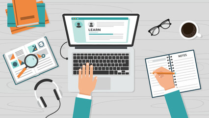 Fototapeta premium Productive online learning and remote education setup with a person using a laptop, headphones, and study materials for acquiring knowledge and developing skills