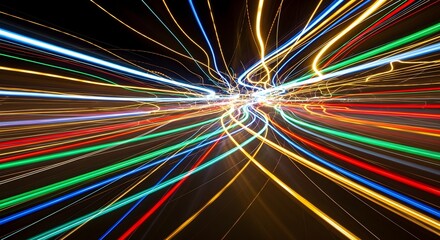 A vibrant display of colorful light trails radiating from a central point against a dark background