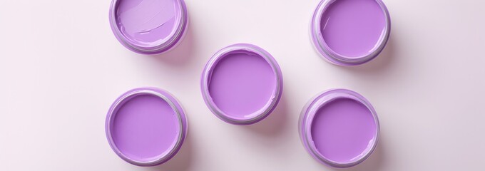 Five open paint cans reveal soft lavender hues, perfect for crea