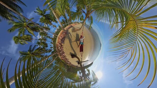 Little Planet View Of Tropical Beach With Man In Hammock Between Palm Trees Surrounded By Sand Sea And Blue Sky Creating Surreal Travel Atmosphere