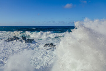 Huge crashing waves in the ocean. Summer and surf concept. Ocean textures. 