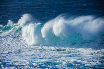 Naklejka premium Huge crashing waves in the ocean. Summer and surf concept. Ocean textures. 