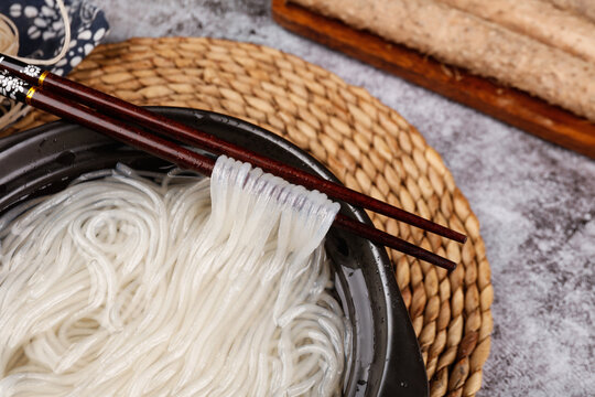 Asian Noodles with Chopsticks and Traditional Cooking Tools