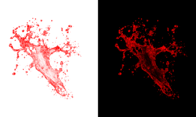 Intense red liquid burst splashing dramatically in chaotic shape cutout isolated on transparent checkerboard and dark background
