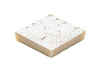 powdered sugar dusted fudge square on white background