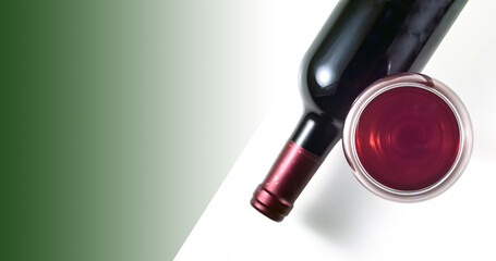 A glass and a bottle of red wine on a white background. Green background for text.