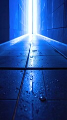 Wet blue hallway with light at the end