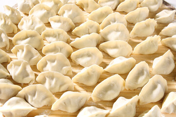 Handmade Traditional Dumplings on Wooden Board - Gourmet Asian Food