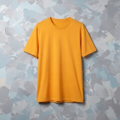 Vibrant yellow t-shirt against abstract background