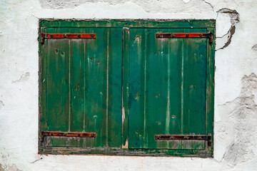 detailed view of green historic colonial building shutter window