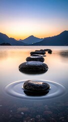 Stones across water at golden sunset