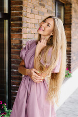 Fototapeta premium Stylish Woman In Pink Dress Outdoors