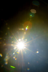 Abstract imitation sun starlight distant galaxy on a black background.