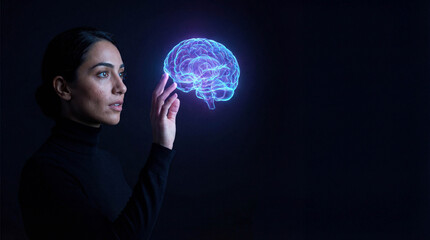 Young Middle Eastern woman touching glowing blue digital brain hologram in dark studio symbolizing artificial intelligence and neuroscience research