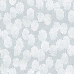 Monochrome pattern of light blue spots on blue background.
