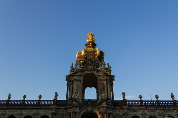 The Golden Crown Gate (Kronentor) of the baroque Zwinger Palace in Dresden, Germany against blue sky