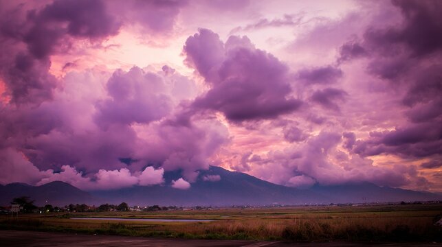 midgard. Dark purple storm clouds gathering before rainfall, dramatic sky formation, natural weather phenomenon. travel magazines, destination branding, designed for travel destination branding.