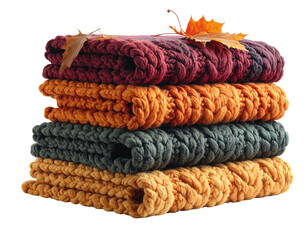 Folded, knitted blankets, autumnal colors, autumn leaves