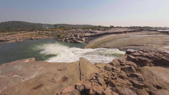 wide shot of sindh river falling through rocky terrain in gwalior region