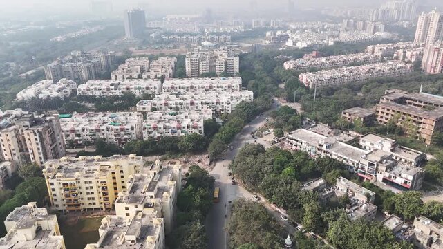 Aerial view of Greater Noida, showcasing planned residential blocks, wide tree-lined roads, and green buffers that highlight the city&rsquo;s structured urban development. Pollution in Novemebr
