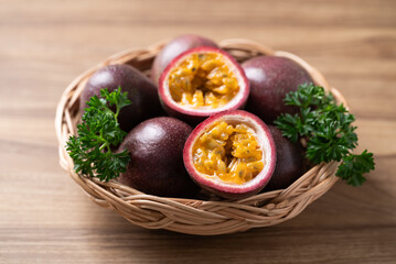 Fresh passion fruit in basket on wooden background, Tropical fruit