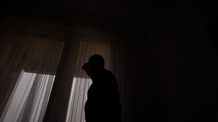 Man with headache, depression, sadness and loneliness at home