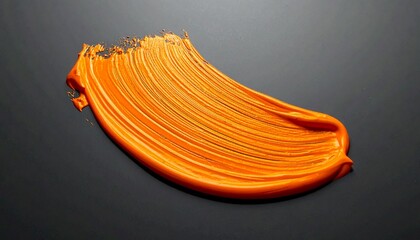 Textured Orange Paint Smear with Dynamic Brushstroke on Black Background