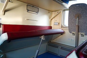Sitting in a passenger train compartment.