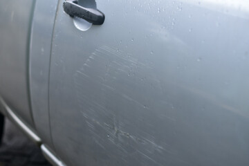Deep scratches on the car body due to accident	