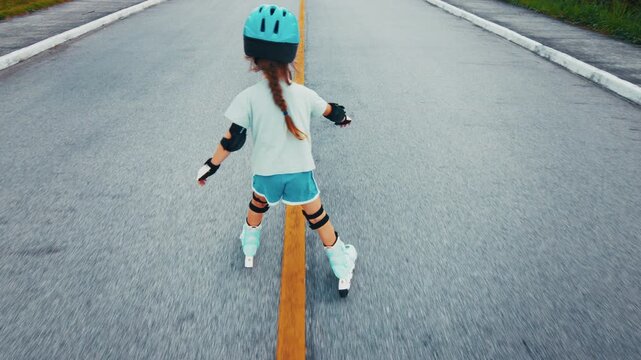 Girl learns roller skating on the safety city area with no traffic and does her first attempts in the sport