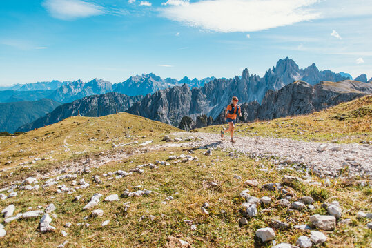 A female athlete enjoys a challenging mountain trail run