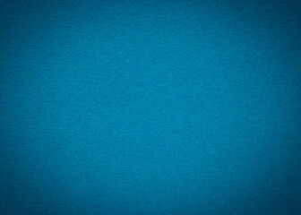 blank background: close up of blue textured craft paper with shadowed border