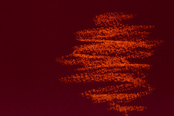 artistic backdrop: close up of oil pastel hatching on dark red paper