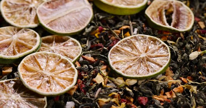 natural green tea with added flavors and pieces of fruit and cut dried green limes , bright large dry lime slices and green tea with pieces of fruit