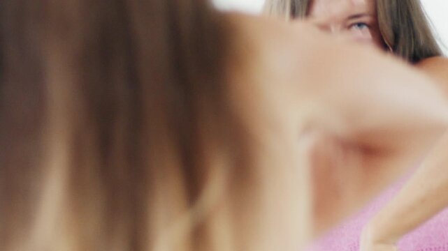 Close up portrait of the young adult woman dancing zumba in the bright airy room