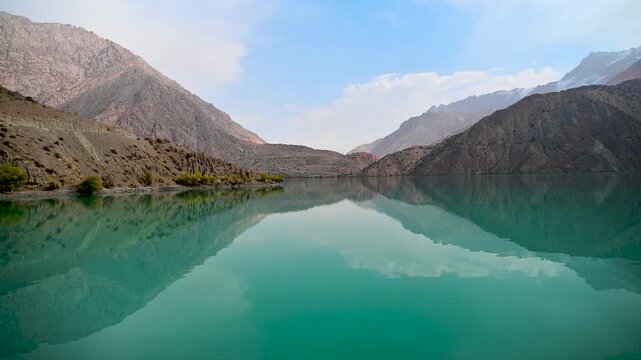 Turquoise Water Reflection at Iskanderkul Lake in Tajikistan