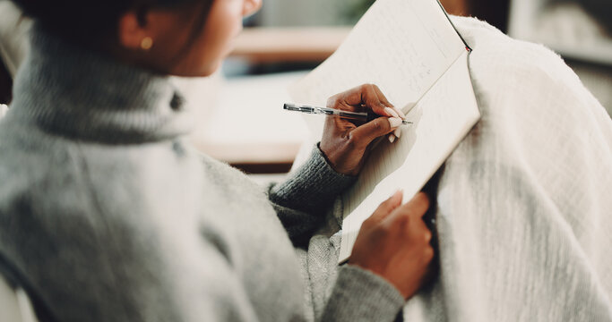 Hands, notebook and writing with woman on sofa for inspiration, journal prompt and reminder. Reflection, agenda and planning with person in living room of home for diary, checklist and brainstorming