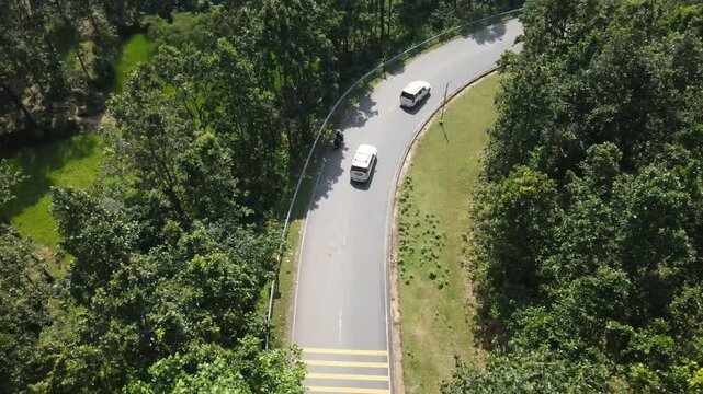 Drone Shot of Scenic Hills and Forest with curved road 